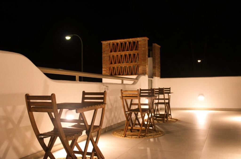 Rooftop terrace with tables in the evening