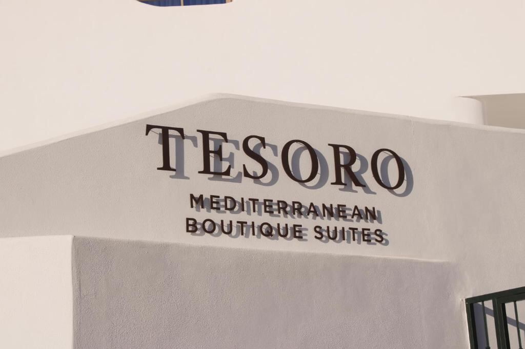 Hotel façade with the Tesoro Mediterranean Boutique Suites lettering