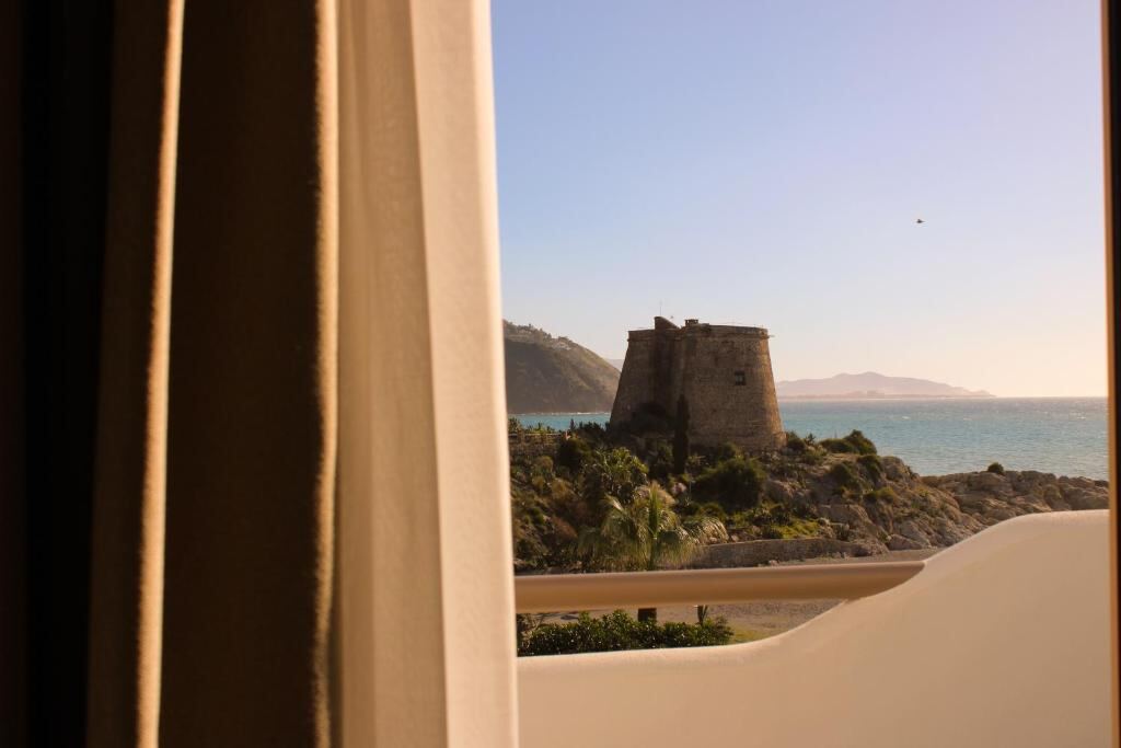 Sea view towards the watchtower from a suite in Almuñécar